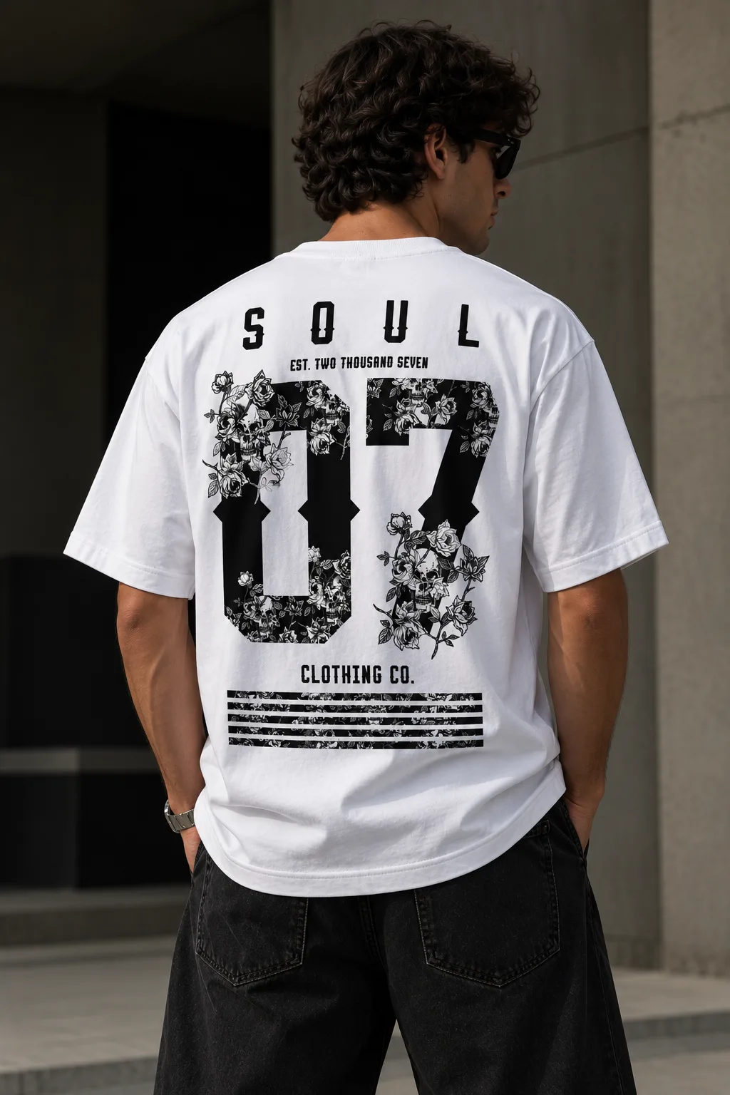 White oversized T-shirt with SOUL 07 floral back graphic worn by a male model