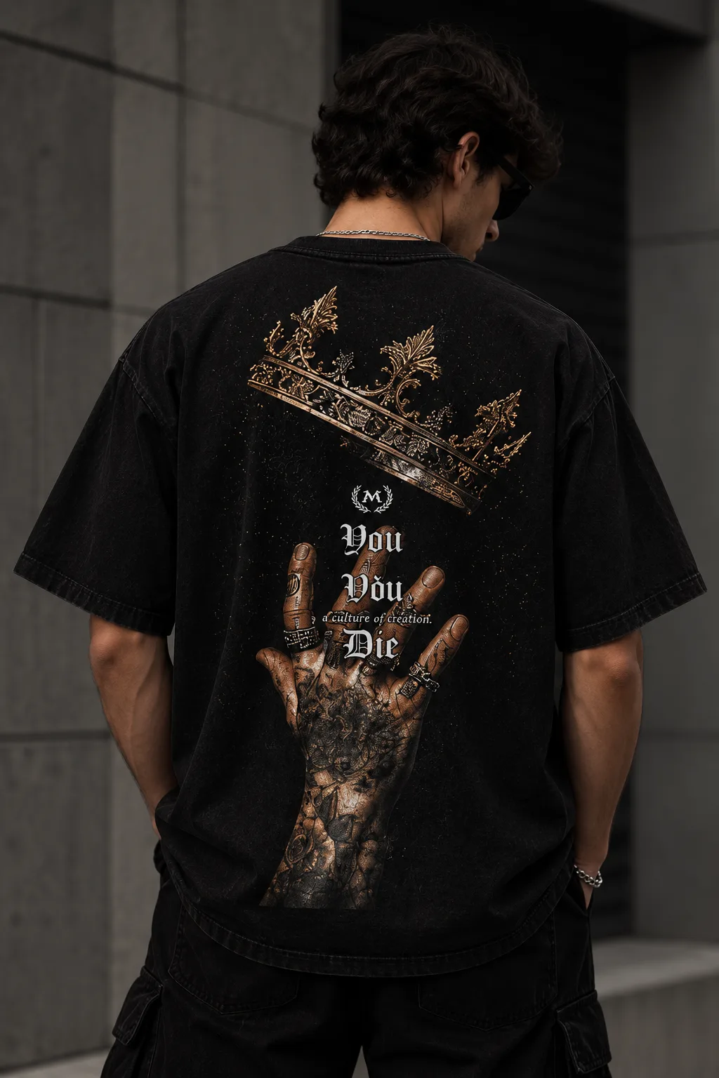 Black and white oversized T-shirts featuring a crown, gothic lettering, and a tattooed hand graphic on the back.