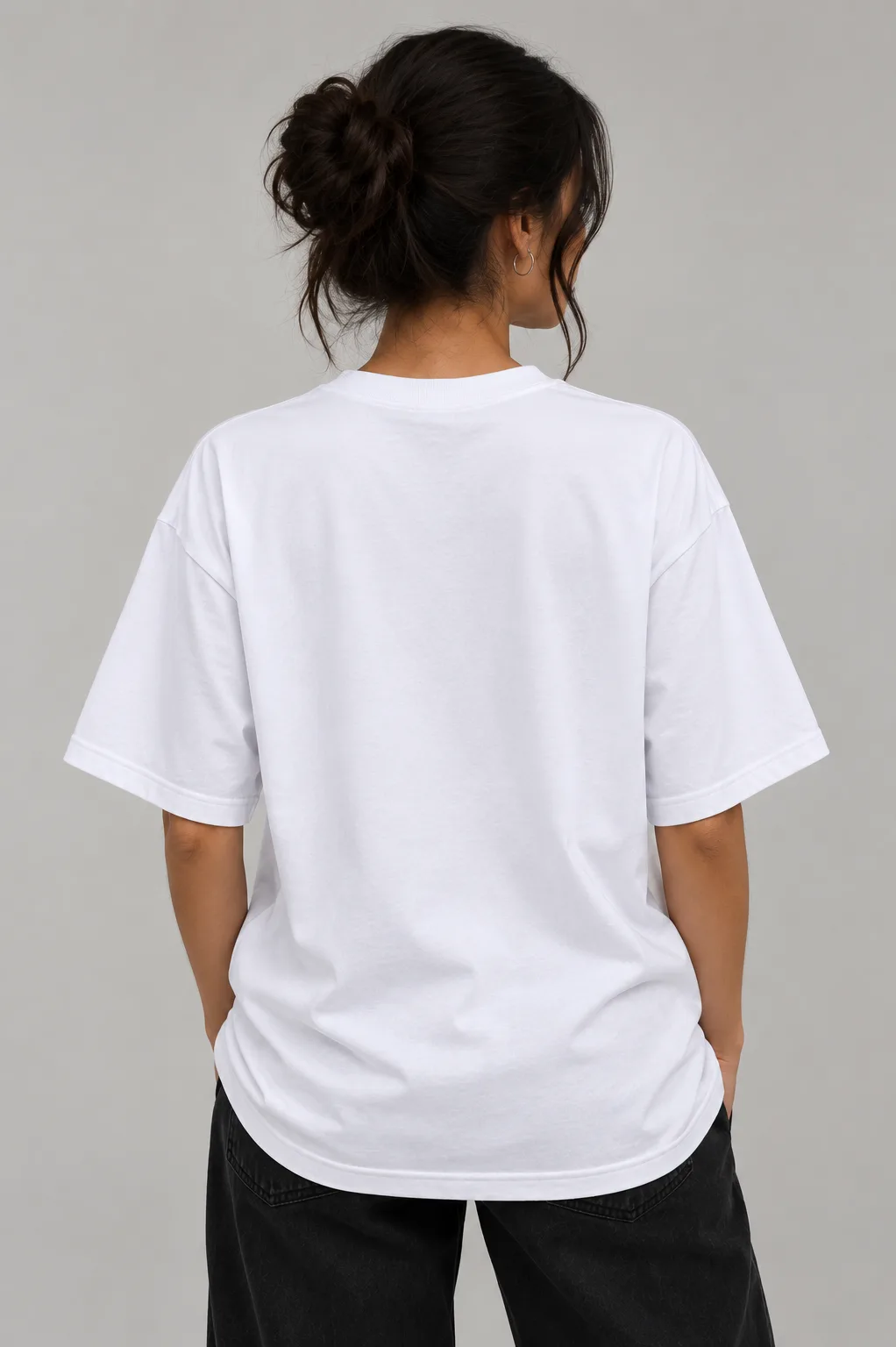 Alt text  Black and white oversized T-shirts featuring a playful cat wearing a cap and headphones with dumbbells on the back.