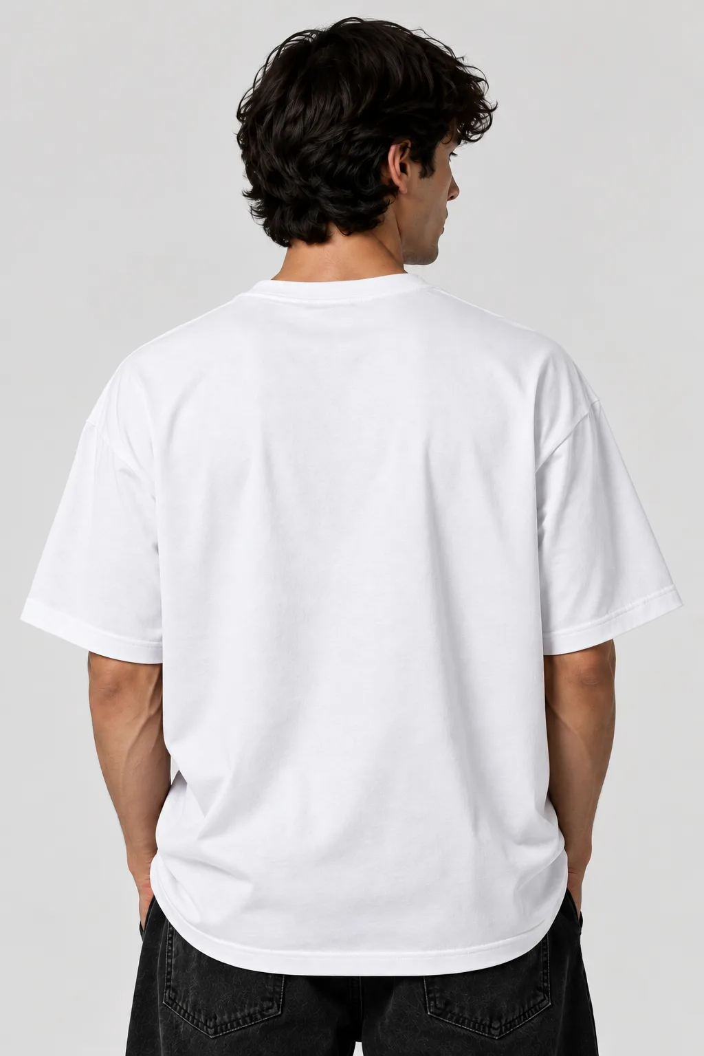 Alt text  Black and white oversized T-shirts featuring a playful cat wearing a cap and headphones with dumbbells on the back.