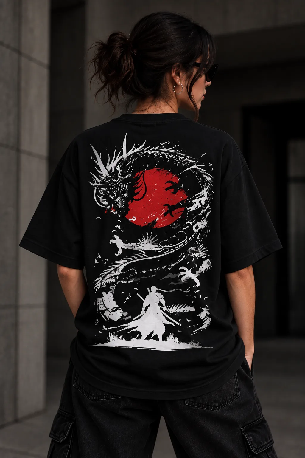 Black and white oversized T-shirts featuring a Japanese-inspired dragon, red sun, samurai silhouette, birds, and dynamic ink artwork on the back.