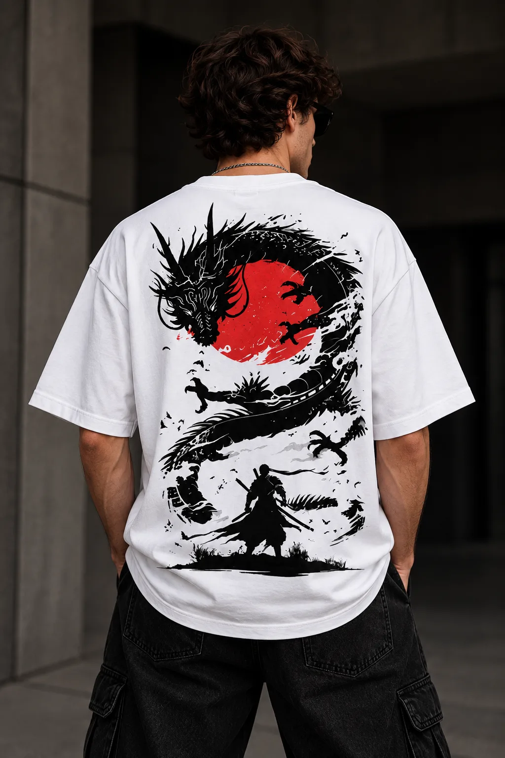 Black and white oversized T-shirts featuring a Japanese-inspired dragon, red sun, samurai silhouette, birds, and dynamic ink artwork on the back.