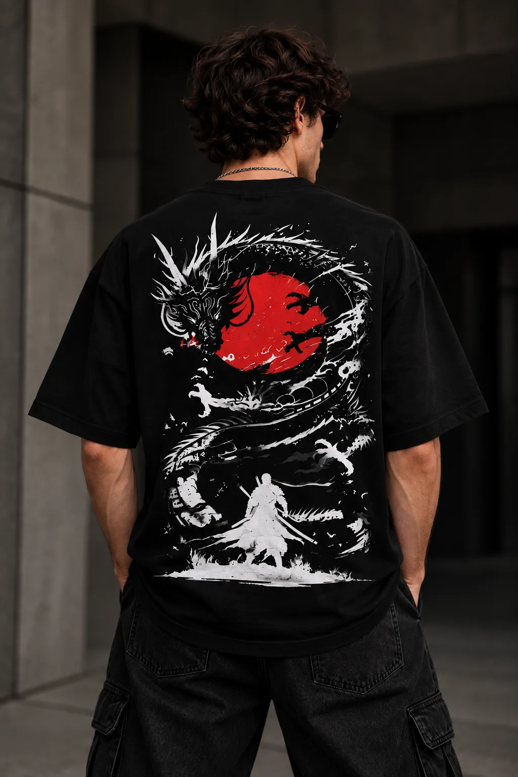 Black and white oversized T-shirts featuring a Japanese-inspired dragon, red sun, samurai silhouette, birds, and dynamic ink artwork on the back.