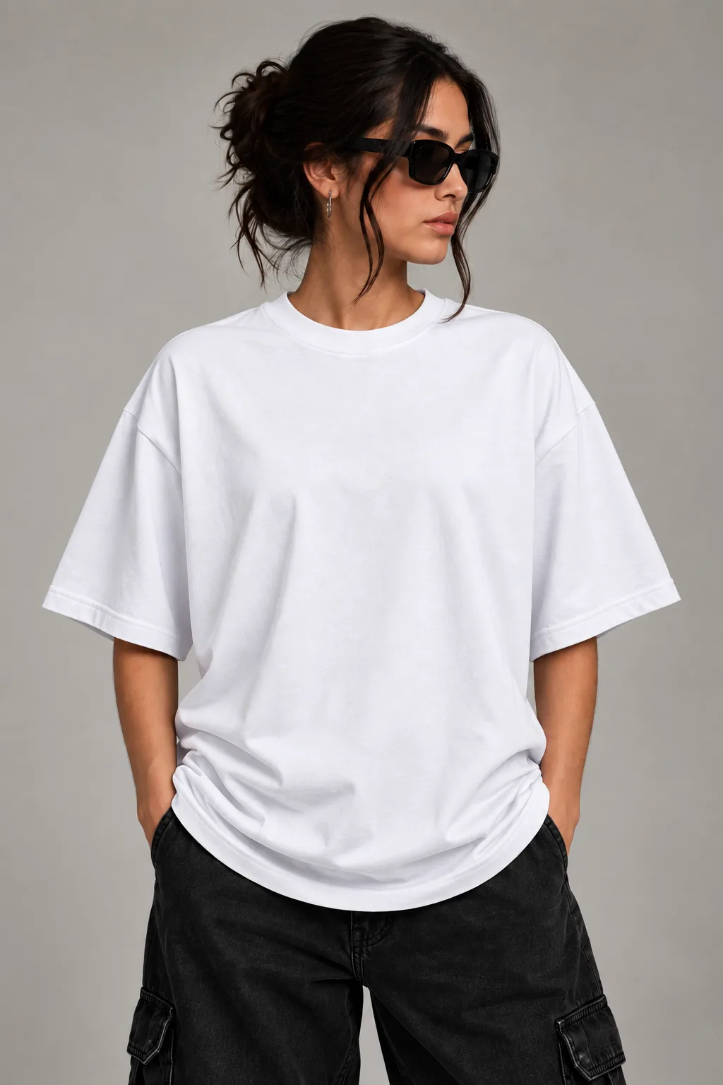 Black and white oversized T-shirts featuring a dark winged guardian figure with a crown-like halo and distressed ink-style artwork.