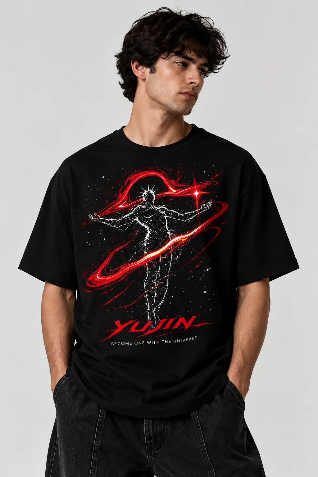 Black and white oversized T-shirt featuring a cosmic human figure surrounded by red energy trails and stars, with “YUJIN” and “BECOME ONE WITH THE UNIVERSE” across the front.