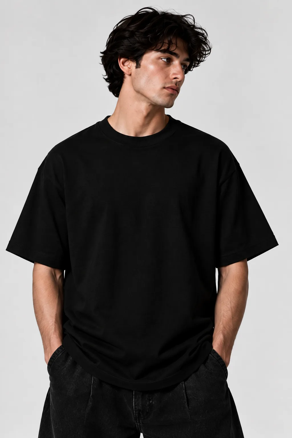 Black and white oversized T-shirts featuring a detailed winged figure against a vibrant cosmic collage.